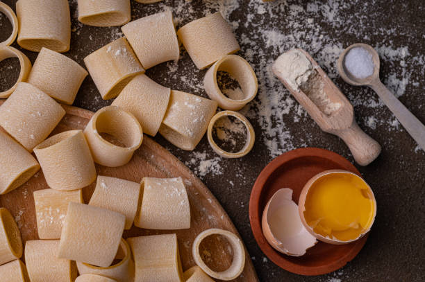 istock Pasta and egg, freshly prepared. Homemade pasta from durum wheat 1551564448