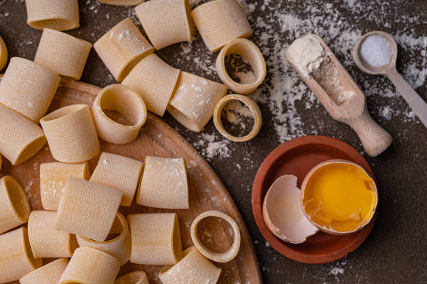 istock Pasta and egg, freshly prepared. Homemade pasta from durum wheat 1551564449