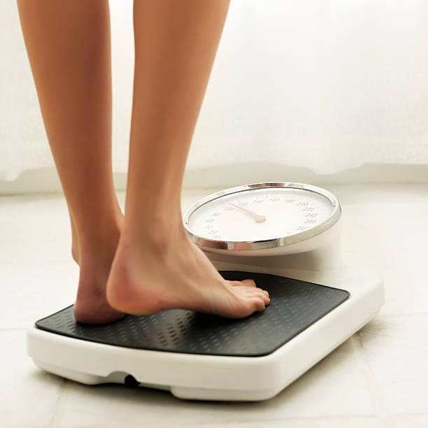 100+ Weight Scale Human Foot Sock Standing Stock Photos, Pictures &  Royalty-Free Images - iStock