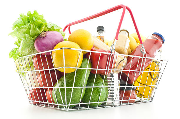 istock Shopping basket filled with groceries and vegetables 155156555