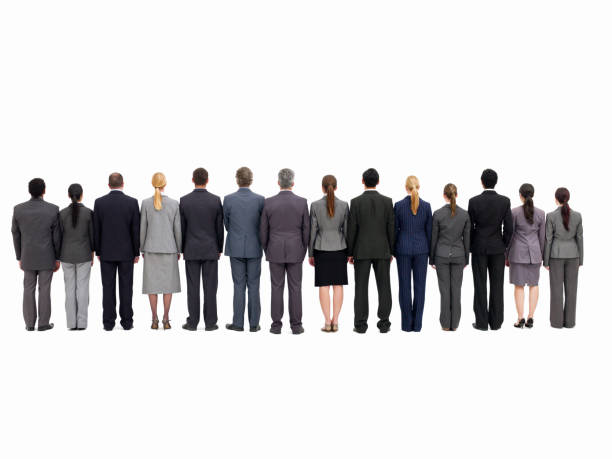 Rear view of businesspeople lined up side by side. Isolated on white. Horizontal shot.