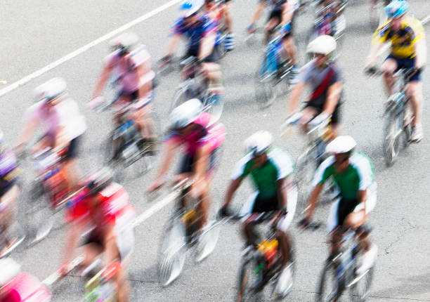 istock Motion-blurred overhead view of speeding cyclists in race 155156664