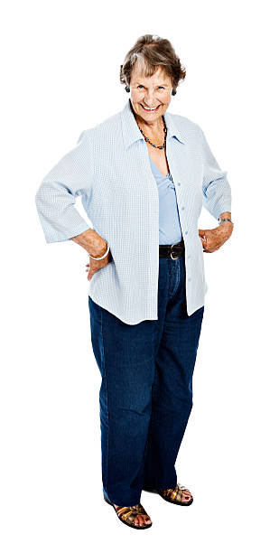 istock Cheerful, fit, confident 84 year old woman standing against white 155156667