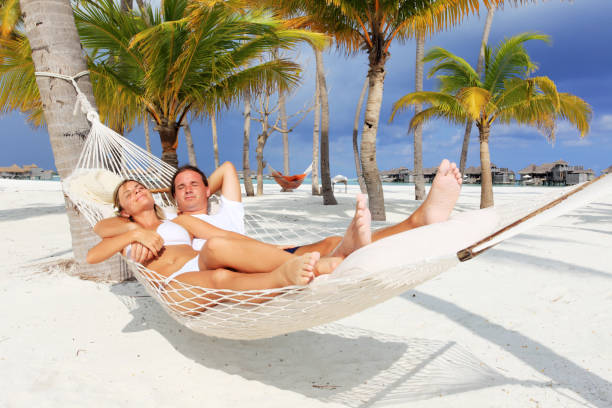 istock Young couple relaxing in a hammock. 155156680