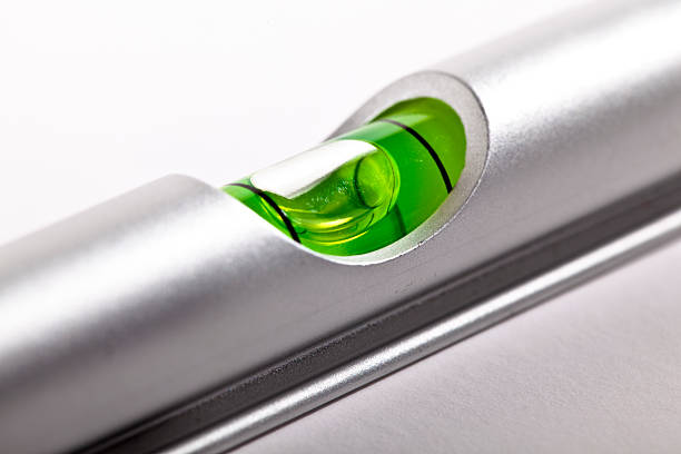 The center liquid area of a silver level aloy water level close-up. spirit level stock pictures, royalty-free photos & images