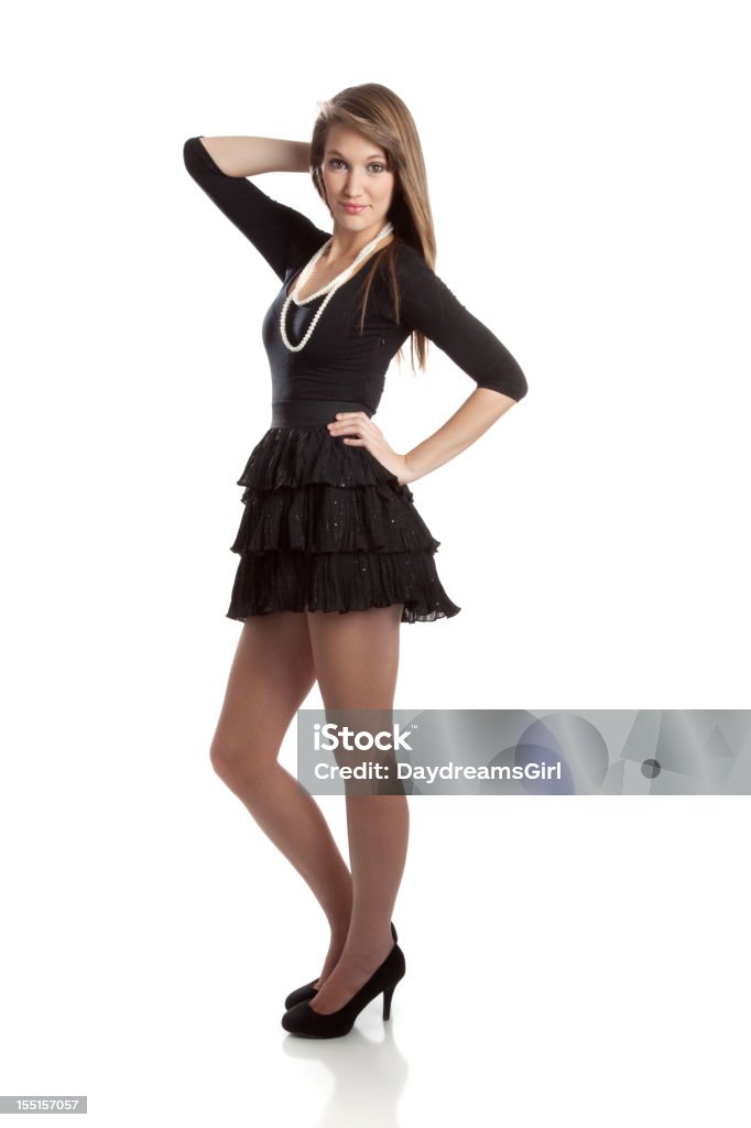 Beautiful Young Woman Wearing Black Dress and Pearls Young woman wearing black dress and pearls. 16-17 Years Stock Photo