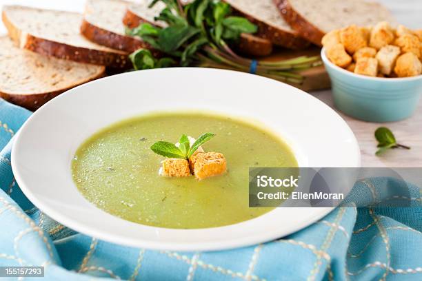 Pea And Mint Soup With Basil And Croutons Stock Photo - Download Image Now - Pea Soup, Soup, Green Color