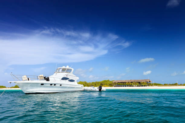 istock Luxury Yachts anchored in a tropical exotic island beach 155157327