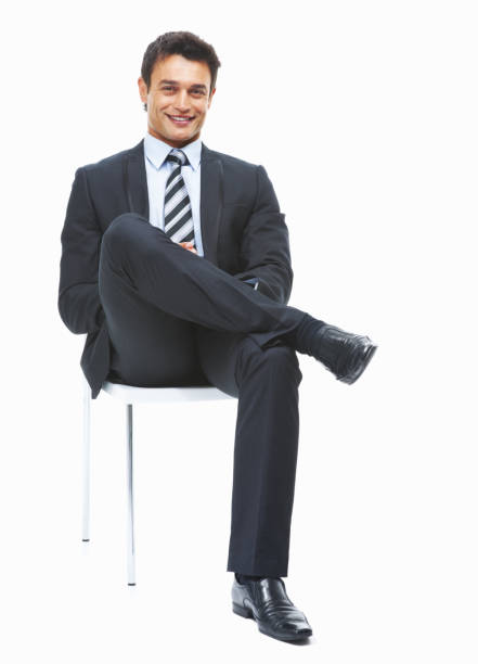 Successful business man sitting and looking confident