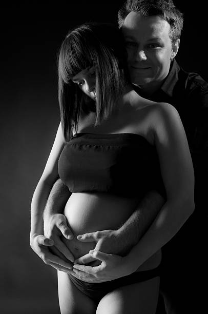 istock Happy affectionate husband and pregnant wife 155157648