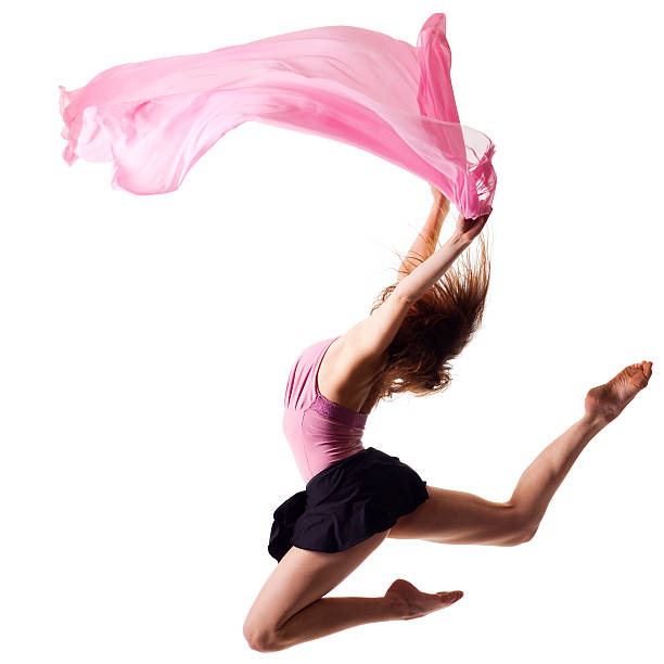 Dancer jump on white background with pink fabric Dancer jump on white background with pink fabric womens field event stock pictures, royalty-free photos & images