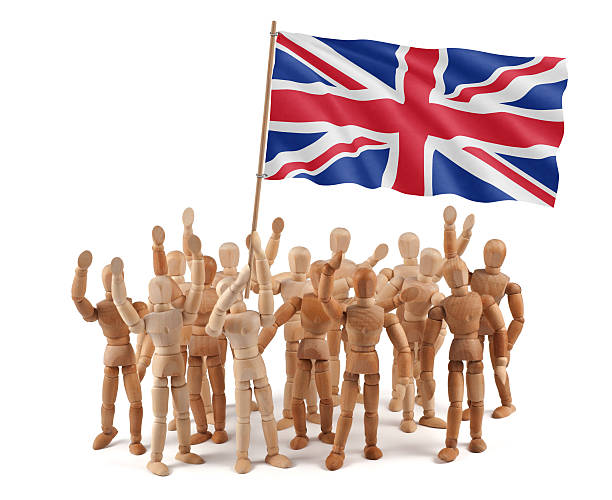 istock United Kingdom - wooden mannequin group with flag 155157723