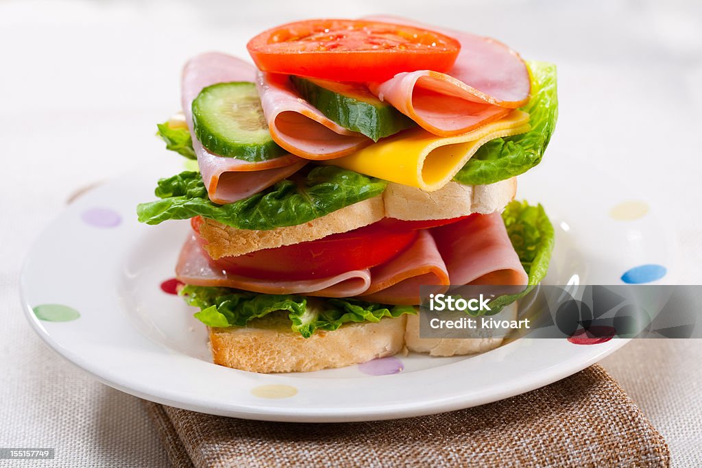 Turkey sandwich A delicious sandwich with turkey, lettuce,tomato and onion 7-Grain Bread Stock Photo