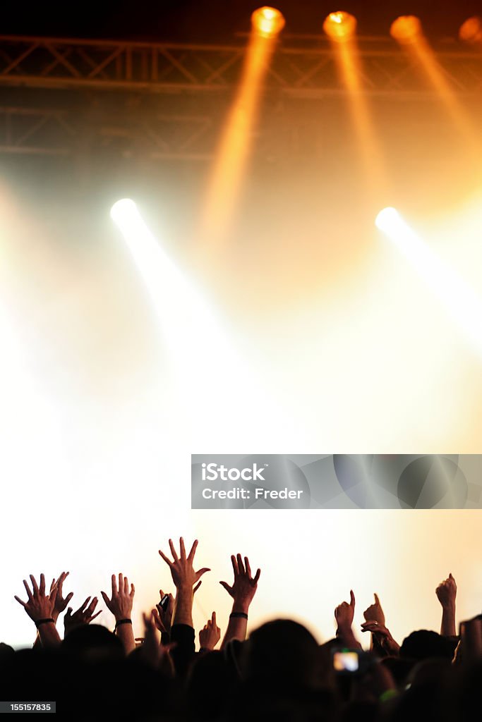 concert crowd silhouettes of people on a rock concert raising hands Fan - Enthusiast Stock Photo