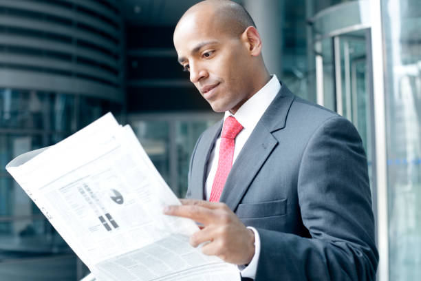 istock Business Man Reading a Newspaper 155157917