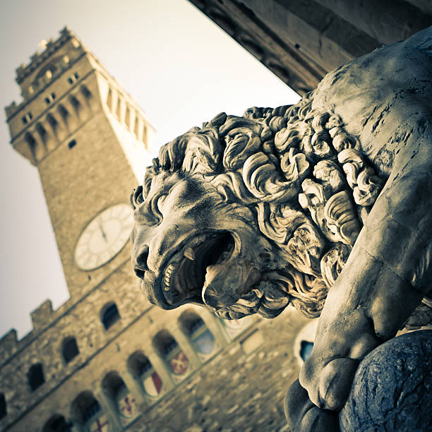 istock Lion Statue with Palazzo Vecchio in Firenze, Italy 155157987