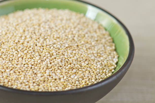 istock Close-up Black Bowl of Uncooked Quinoa 155158036