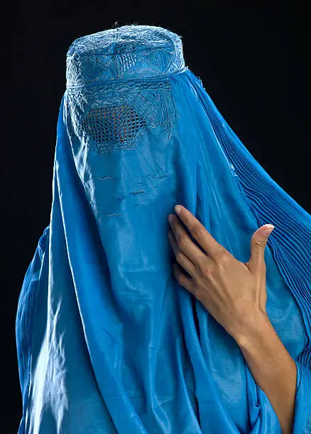 headshot of an Afghan woman wearing her burkha veil  (this picture have been shot with a Hasselblad HD3 II 31 megapixels) 