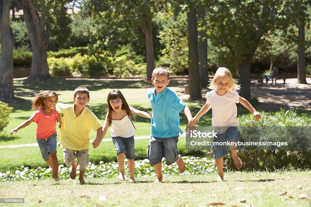 Group Of Children Running In Park  4-5 Years Stock Photo