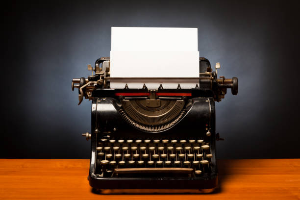 typewriter with blank sheet of paper stock photo