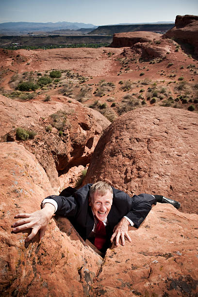 istock Businessman Climbing Up Rockface 155158807
