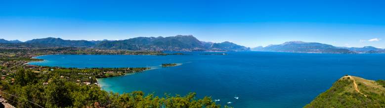 This beautiful view on lake Garda was taken from the Natural Park of the Rock of Manerba, a place of natural and historical interest that protects a diverse variety of plant species belonging to different climates. Extraordinary is the view of Lake Garda you can enjoy from the top of the hill. Italy.