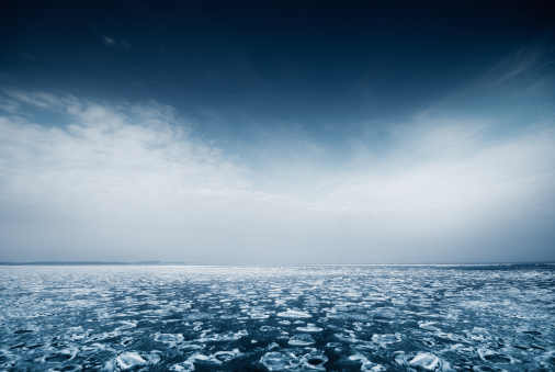 A winter landscape with packed ice in the sea.