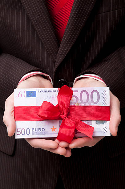 istock A stack of 500 euro banknotes tied with a red ribbon 155159052