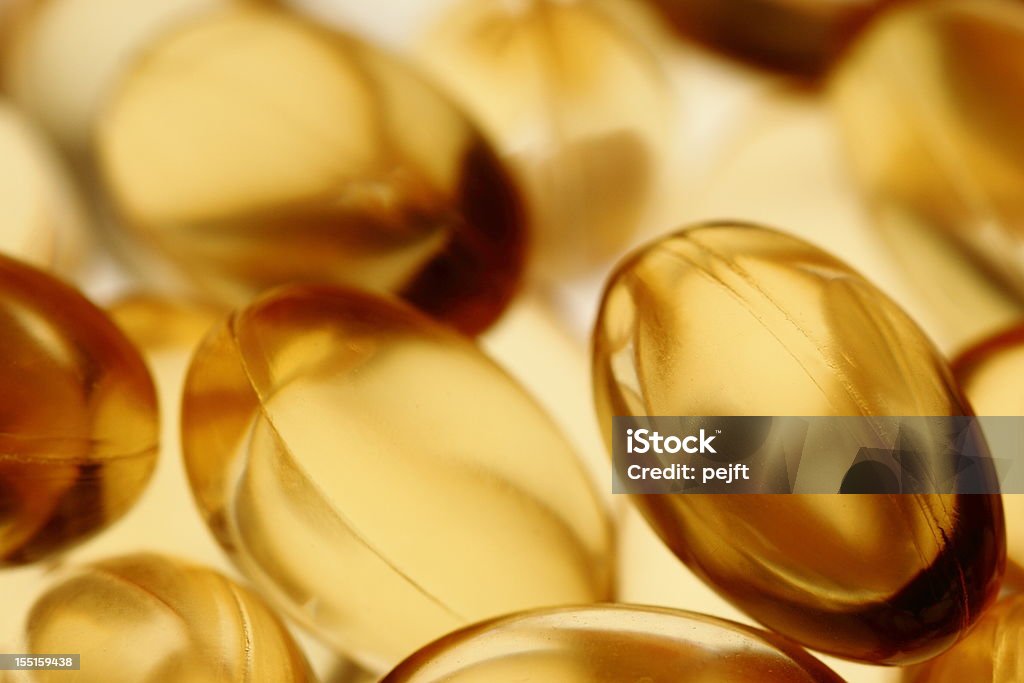 Golden-gel vitamin Omega - 3 Fischöl Kapseln - Lizenzfrei Goldfarbig Stock-Foto