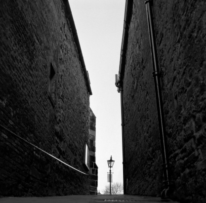 Durham, England - March 6, 2011: From the western side of Palace Green a narrow lane called Windy Gap leads to the wooded river bank. Film grain visible (scan from 120 Delta 3200)