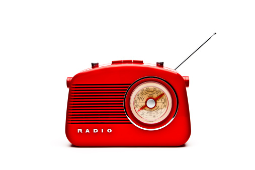 Retro red radio isolated on a white background.