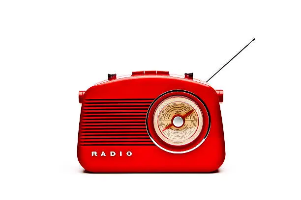 Retro red radio isolated on a white background.