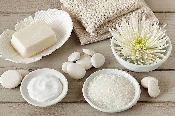 istock Spa still life with soap, bath salt, flower, washcloth, pebbles 155159503