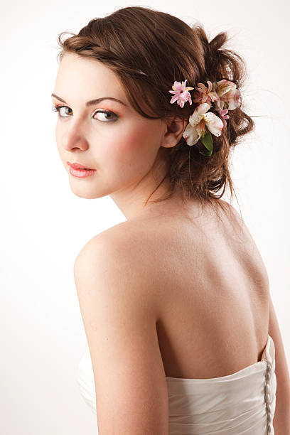 Bride glanses over her shoulder stock photo