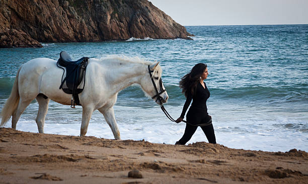 istock Woman and horse 155159703