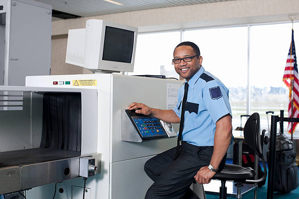 airport security check point with african american guard - airport security bildbanksfoton och bilder