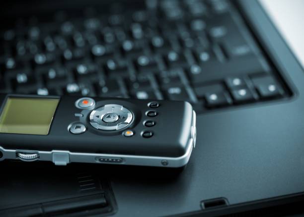 Digital Voice Recorder lying on laptop