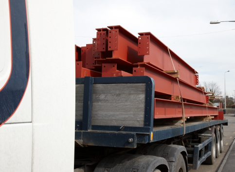 Large lorry with heavy steel girders