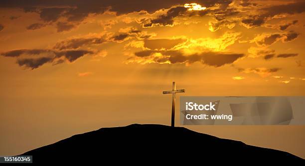 Christian Cross Atop A Hill Against A Morning Sunrise Stock Photo - Download Image Now