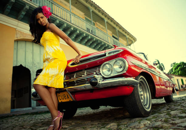 istock Beautiful woman posing with a red car 155160423
