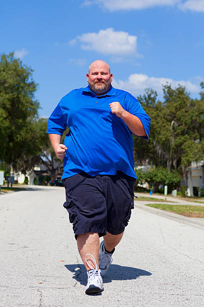 An overweight man begins an exercise regime to get back into shape.