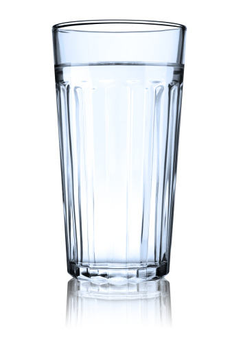Studio isolated glass filled with water with reflection - clipping path around glass. Canon 5D MarkII.
