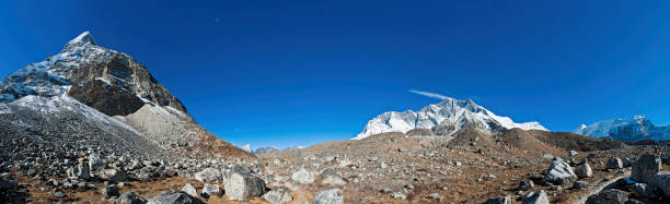 istock Wilderness trail through giant mountain peaks Nepal 155160650