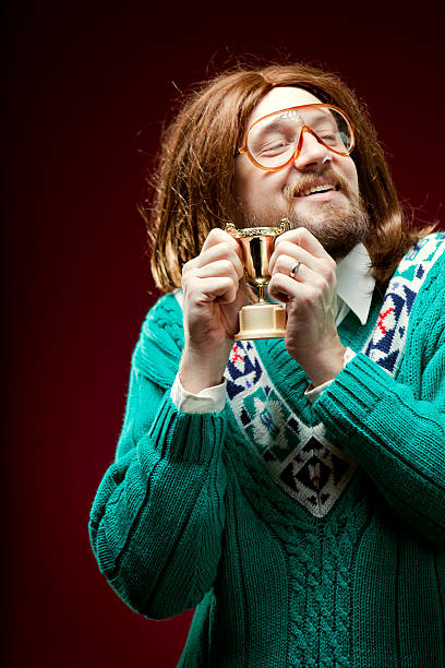 istock Goofy Nerd With Bad Sweater Wins Trophy 155160711