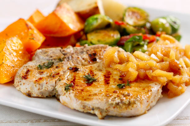 istock Garlic-herbed Pork Chops with Applesauce 155160953