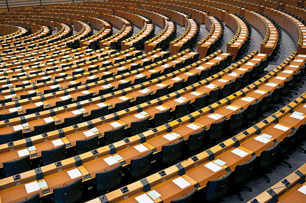 Semi-Circle of Empty Seats European Parliament Brussels Empty Assembly Room of European Parliament prepared for meeting, Belgium, Europe. european parliament stock pictures, royalty-free photos & images