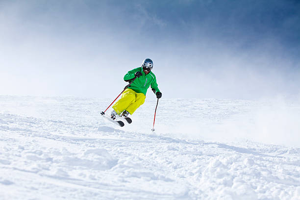 istock Man skiing in fresh powder snow 155161403