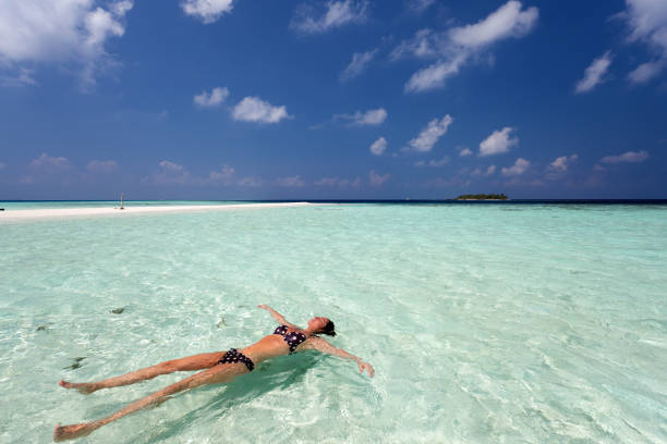 istock Tropical dream with young woman in shallow water 155161861