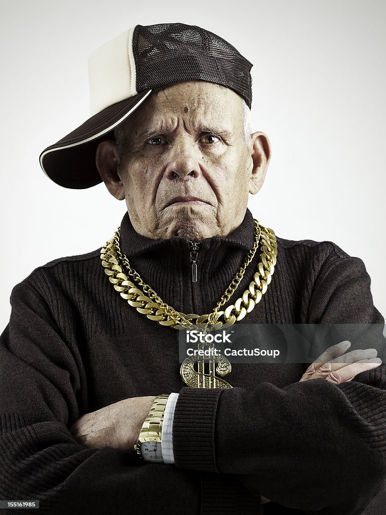 Old School grandfather with a cap and golden chains Rap Stock Photo
