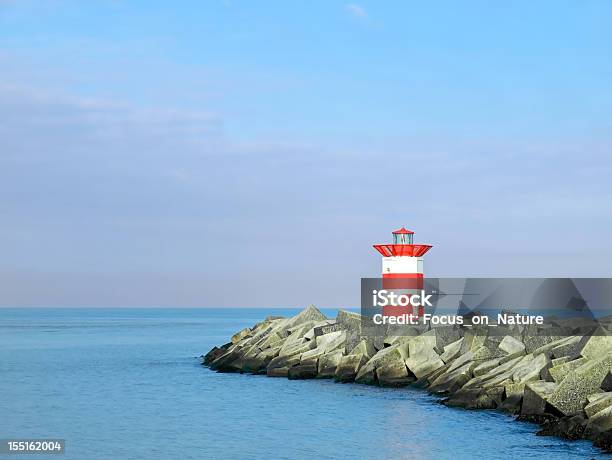 Lighthouse On A Jetty Stock Photo - Download Image Now - Bay of Water, Beach, Blue